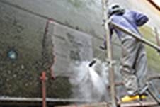 a ships hull is cleaned to the bare metal